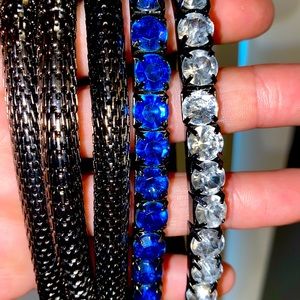 Stacked metal & gem bracelets.